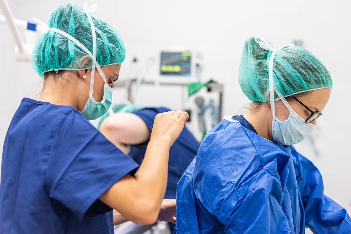 medical assistants putting on scrubs